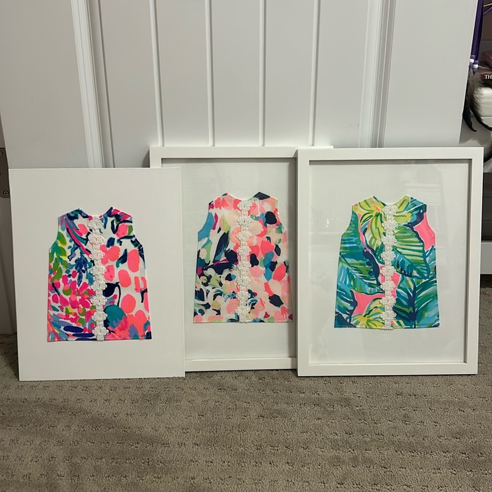Lilly Pulitzer dresses on fabric for framing.
